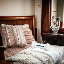Automatic interactive Wickedbone Petzoor PlayBone toy on a cozy bed.